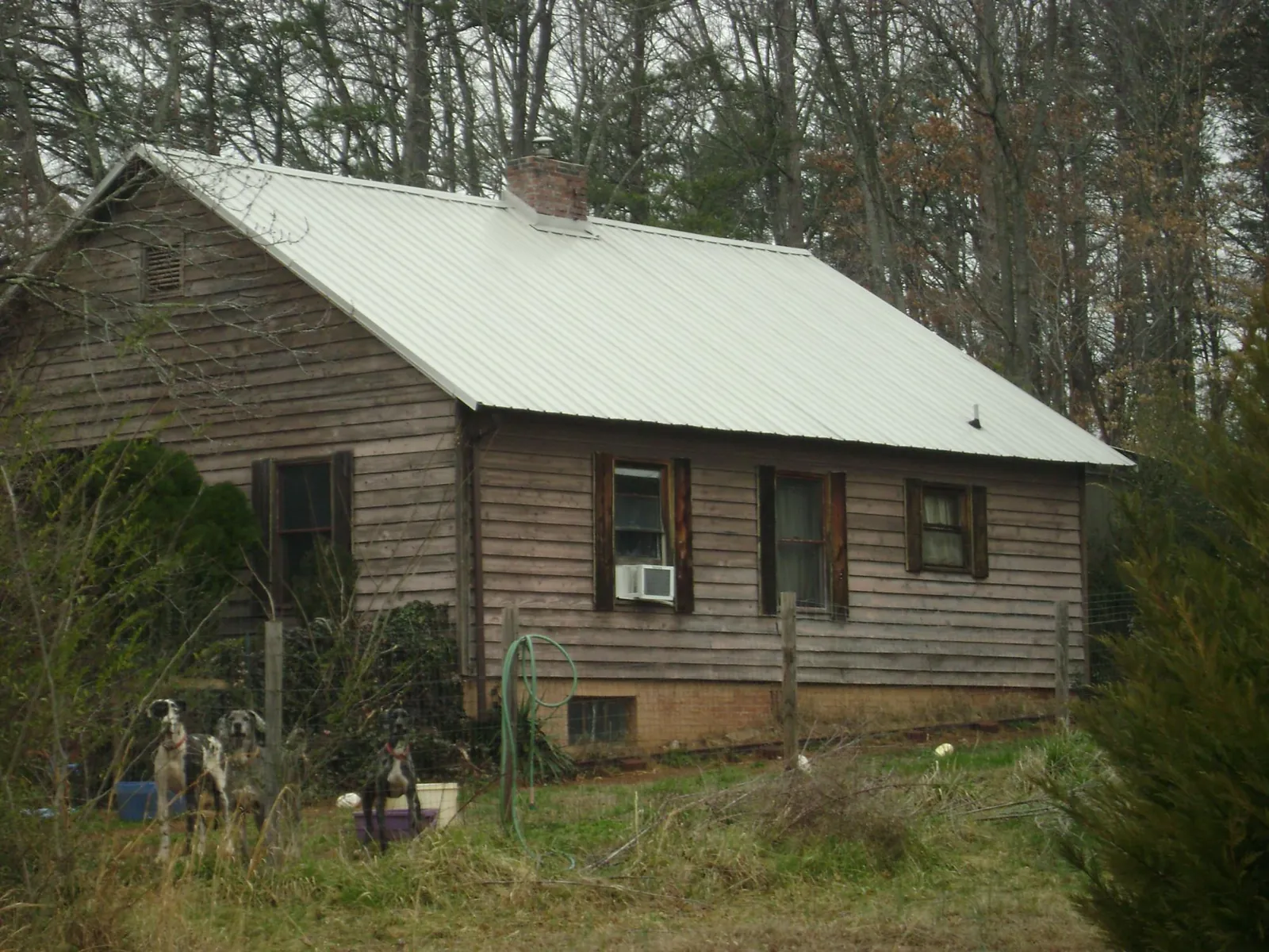 White metal roof on an old wood sided farmhouse, from a Metal Roof Installation job in Allamuchy